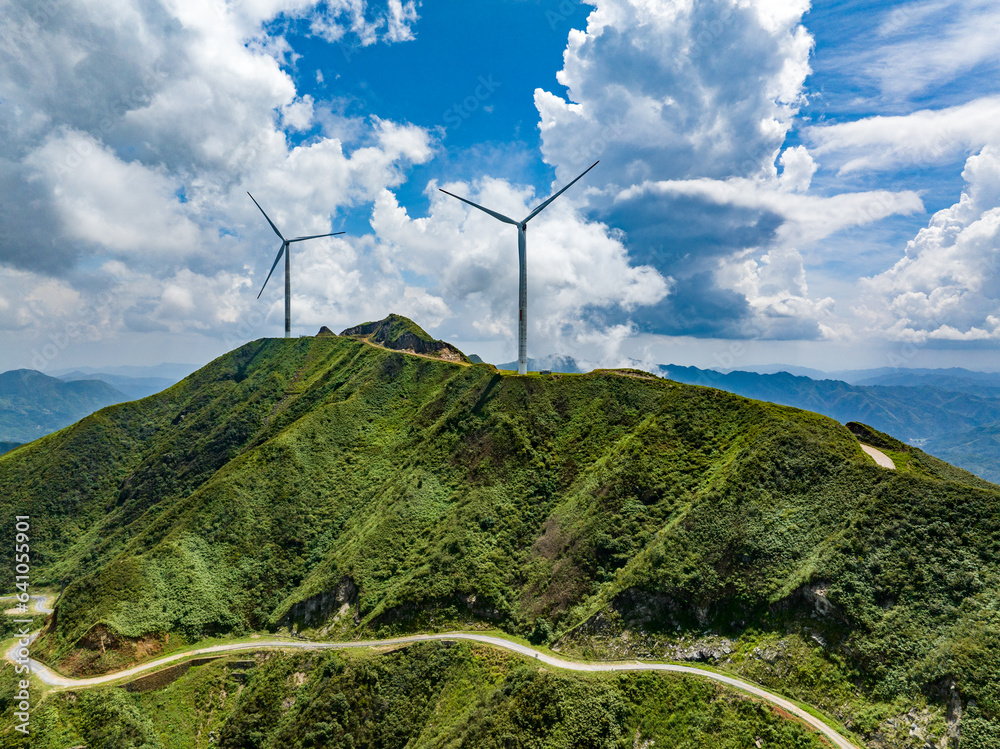 Wind power on the mountain, blue sky and white clouds