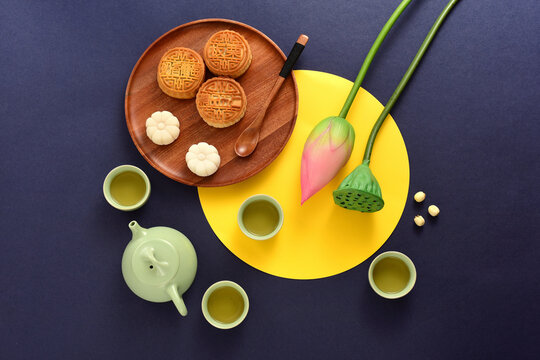 Background of Chinese Traditional Festival Mid-Autumn Festival.The Chinese meaning on the mooncake in the picture is: high-quality five kernels, milk flavored grapes, chestnuts, three flavors.