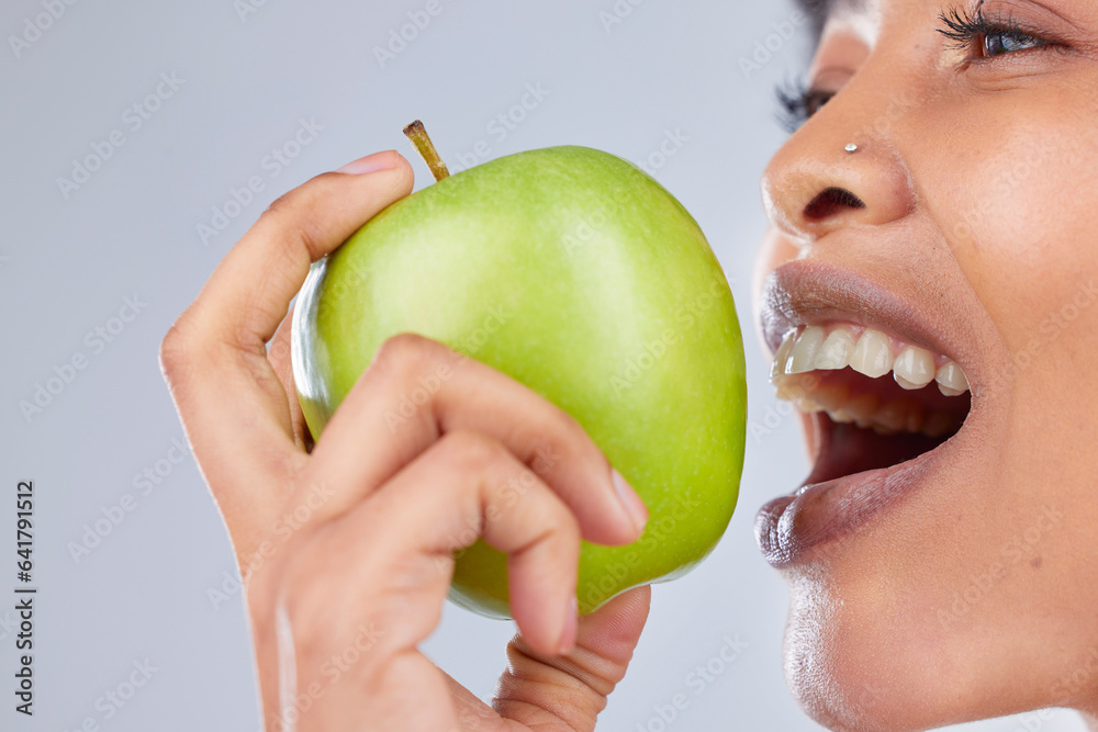 Apple, black woman and eating with health, diet and natural skincare glow in studio. Happy, face and