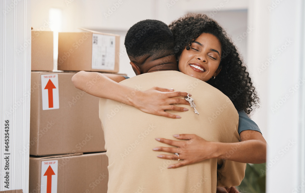 Happy couple, hug and real estate in new home, moving in or boxes for investment or ownership togeth