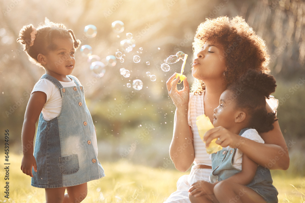 Nature, children and mother blowing bubbles in an outdoor park for playing, bonding or having fun. H