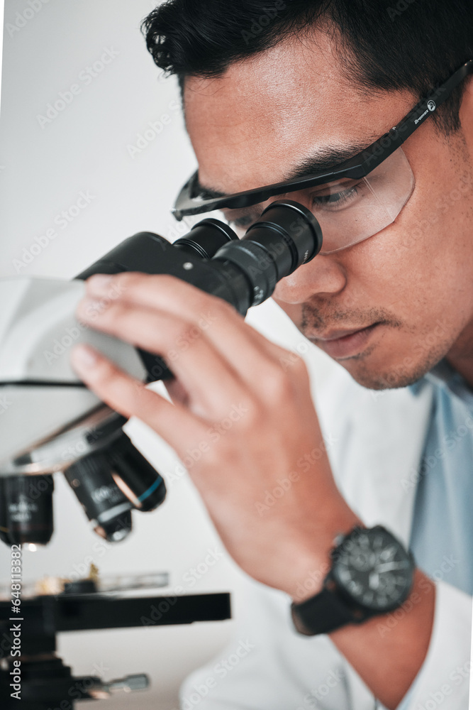 Microscope, face of man and laboratory for science research, dna analysis and studying chemical development. Asian scientist, biotechnology and check lens to review investigation, test and assessment