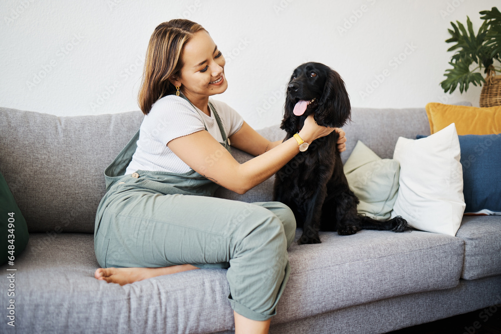 Care, love and woman with dog in home sofa to relax and play with animal. Pet owner, happy and asian person on floor with companion, smile and wellness or friendship and together in cozy apartment