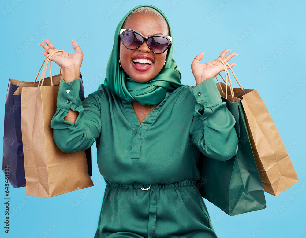Shopping bag, studio and black woman excited for fashion spree, mall store sales or boutique deal, giveaway or shop offer. Retail therapy gift, choice and wealthy African customer on blue background