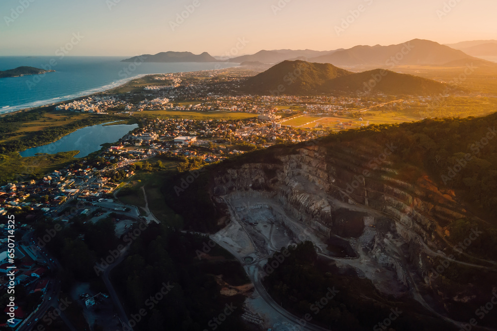 Campeche village area in Florianopolis with quarry, ocean and sunset lights
