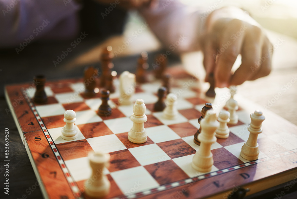 Hands, chess game and board with strategy in competition or challenge, intelligence and closeup of people playing. Thinking, planning and contest outdoor, concentration on boardgame and recreation