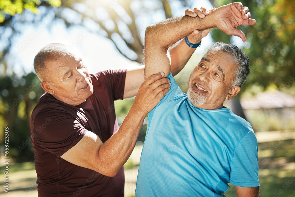 Senior man, friends and stretching at park for workout, exercise or outdoor training together. Mature male person or team in body warm up, arm stretch or preparation for cardio or fitness in nature