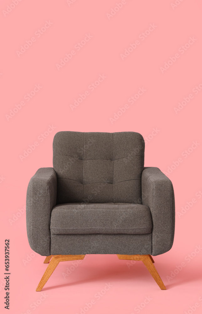 Brown armchair on pink background