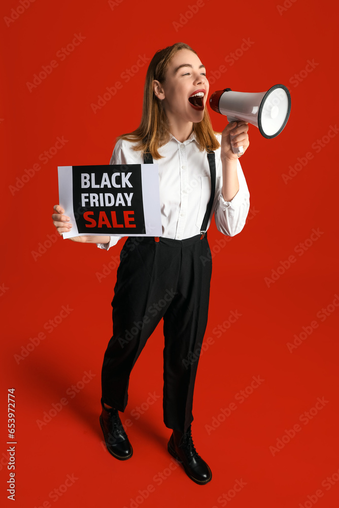 Young woman with card shouting into megaphone on red background. Black Friday sale