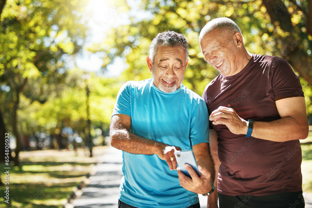 Social media, men and a phone in a park for fitness, training results and conversation about an app. Happy, communication and senior friends with a mobile to monitor health after exercise or running