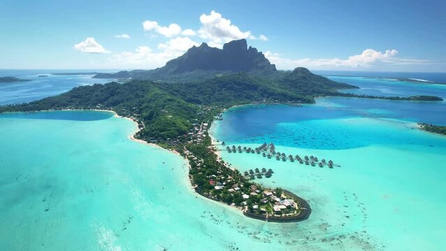 Drone aerial Tahiti. Bora Bora island. Flying above clear water lagoon beach. French Polynesia. Exotic travel vacation getaway, romantic honeymoon destination.