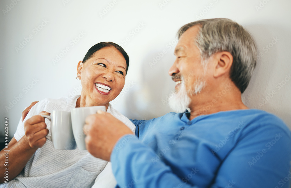 Senior, coffee or happy couple in bedroom at home bonding or talking in marriage together. Cheers, drinking morning tea or Asian woman laughing with a romantic old man in retirement to relax