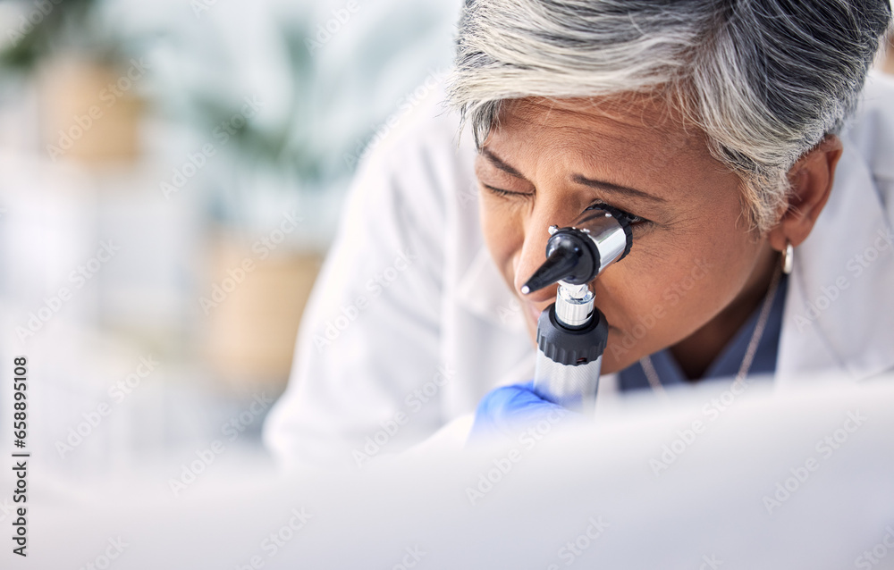 Mature woman, doctor and otoscope, hearing test and exam for audiology check, consultation and healthcare. Ent tools, otolaryngology and medical professional with equipment for wellness in hospital