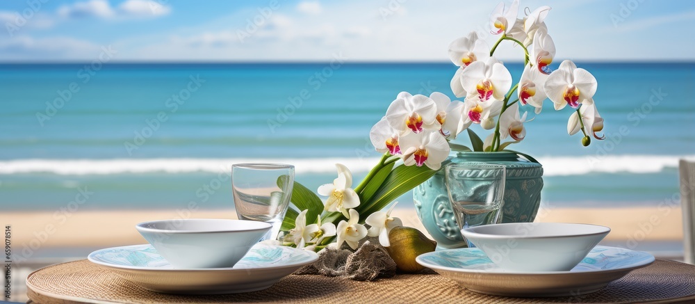 Oceanfront resort restaurant with tropical table decor and orchids
