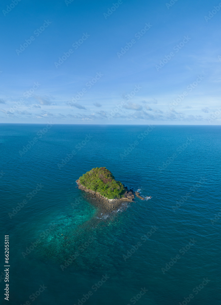 Seascape with small island. Blue sea surface from above, sea from a drone. Beauty of nature concept backgroun. beautiful island