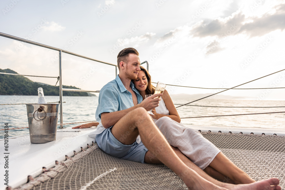 Caucasian romantic couple looking at beautiful view during yachting. 