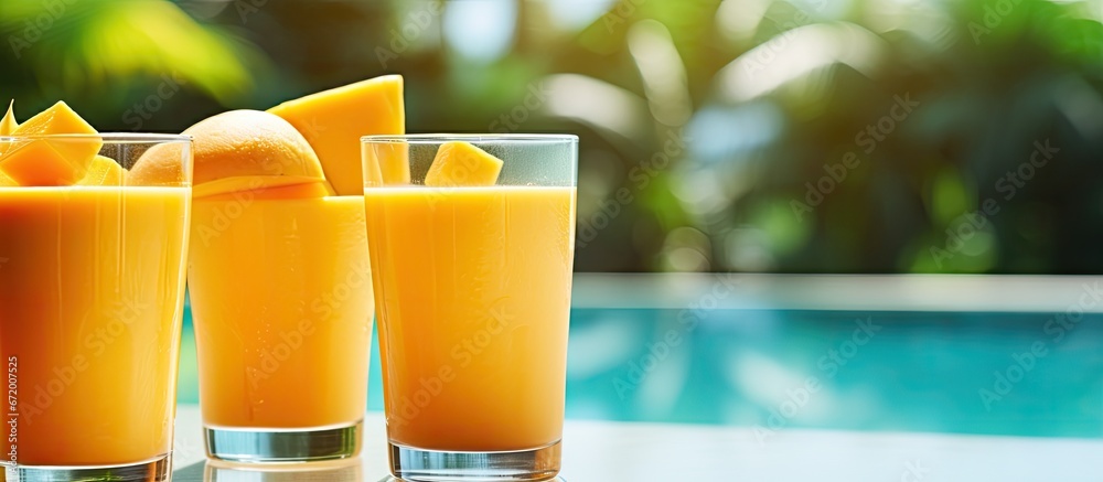 Mango juice can be enjoyed during the day by the pool served in glass cups This refreshing beverage is perfect for restaurants as well as creating a pleasant ambiance