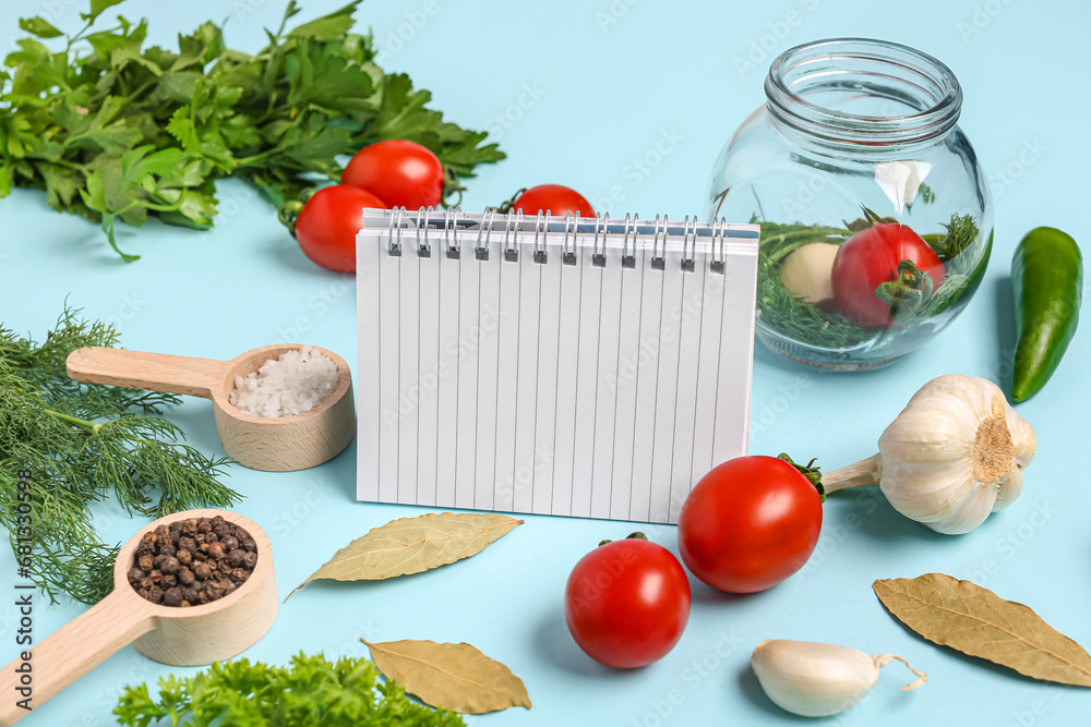 Composition with blank recipe book, spices, herbs and vegetables on color background
