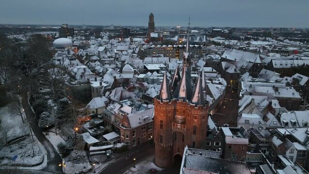Zwolle Sassenpoort gate in the downtown district aerial view at the Sassenpoort during a cold winter morning with snow on the rooftops.