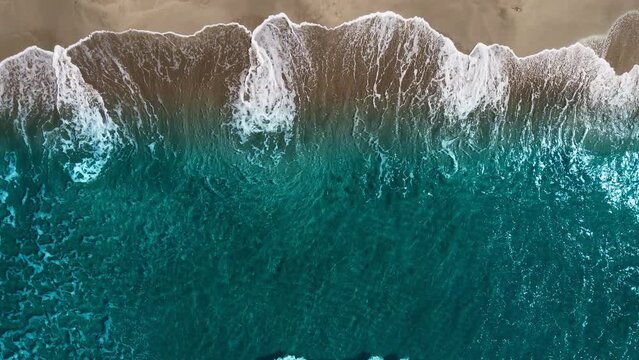 Top down view of sea waves break on sand. Beautiful of sea water wave come to beach