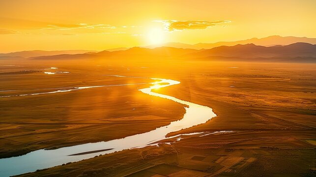 Golden Glow: The Setting Sun Illuminates the Majestic Yellow River in a Breathtaking Display of Nature's Beauty