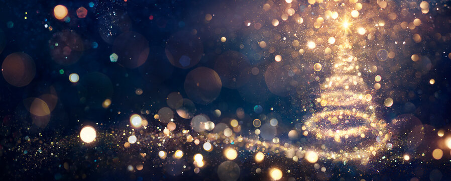 闪亮夜晚的圣诞树 - 抽象蓝色背景中的金色闪耀