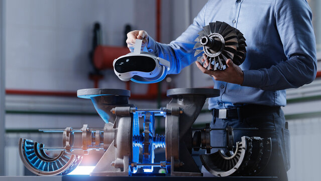 男性工程师在工厂环境中使用VR技术检查工业机械