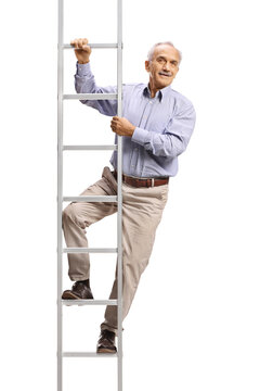 Elderly man standing on a ladder and looking at camera